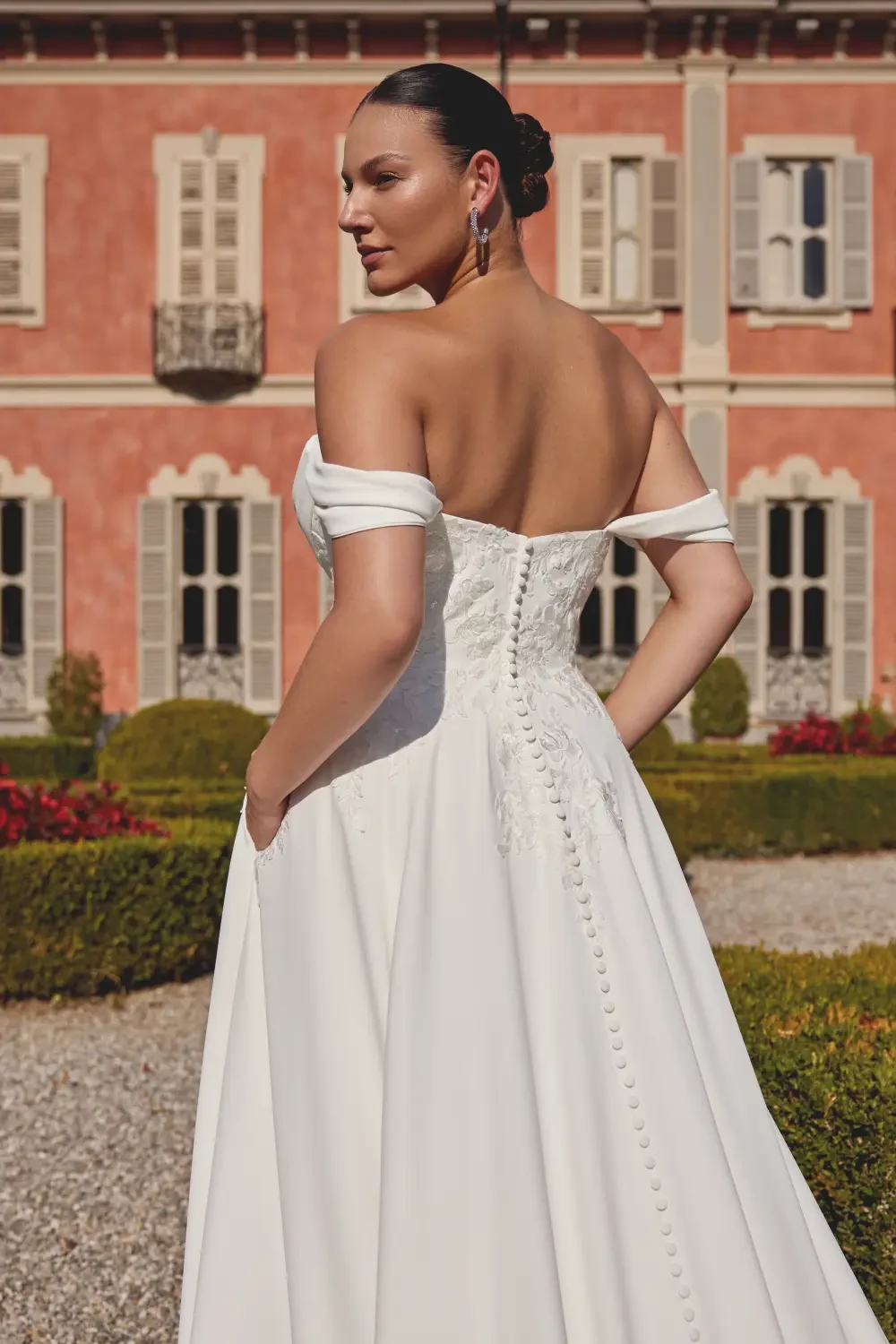 Model wearing a white gown
